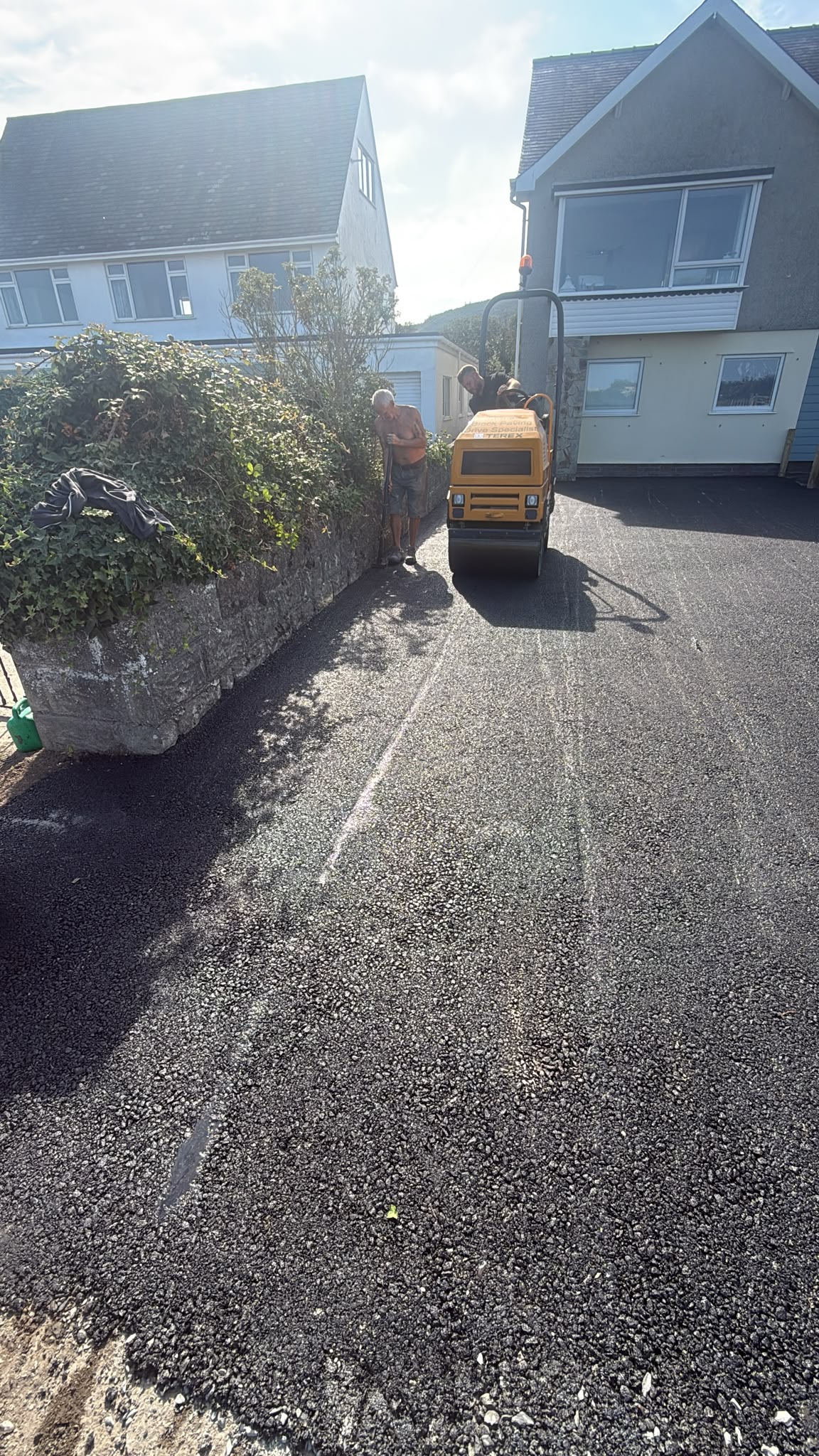 Tarmac driveway being rolled and compacted in Porthmadog